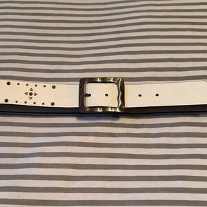White belt with small silver studs and ruby red rhinestones.